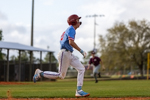 Player Makes a Run to First Base